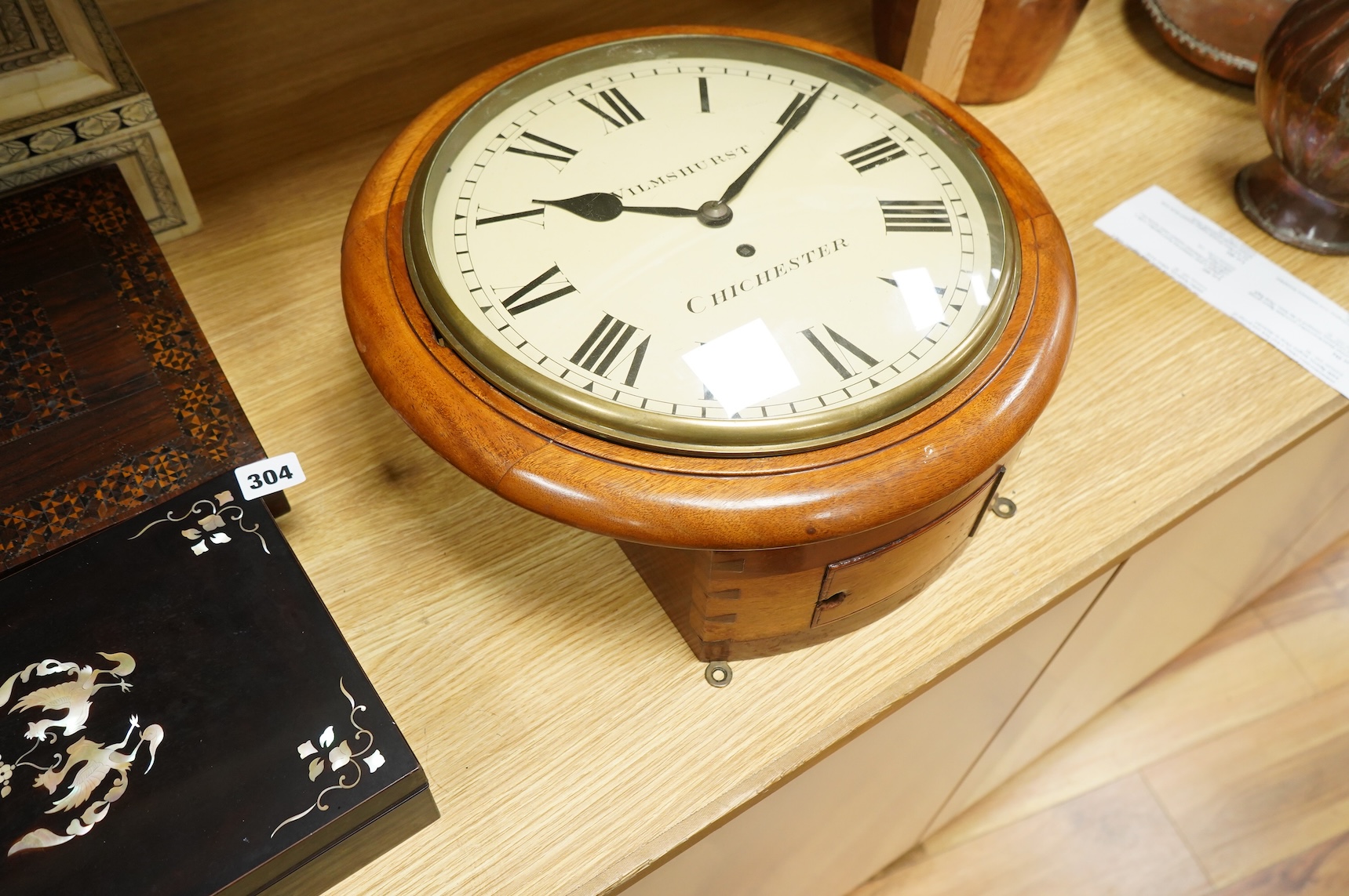 A circular dial mahogany cased wall clock with a single train fusee movement, painted dial reading Wilmshurst, Chichester, 39cm in diameter